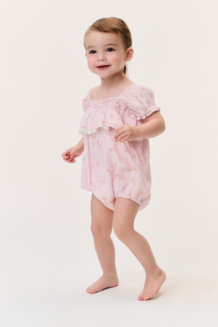 Baby ditsy floral pinafore romper in light pink with tiered ruffle shoulders