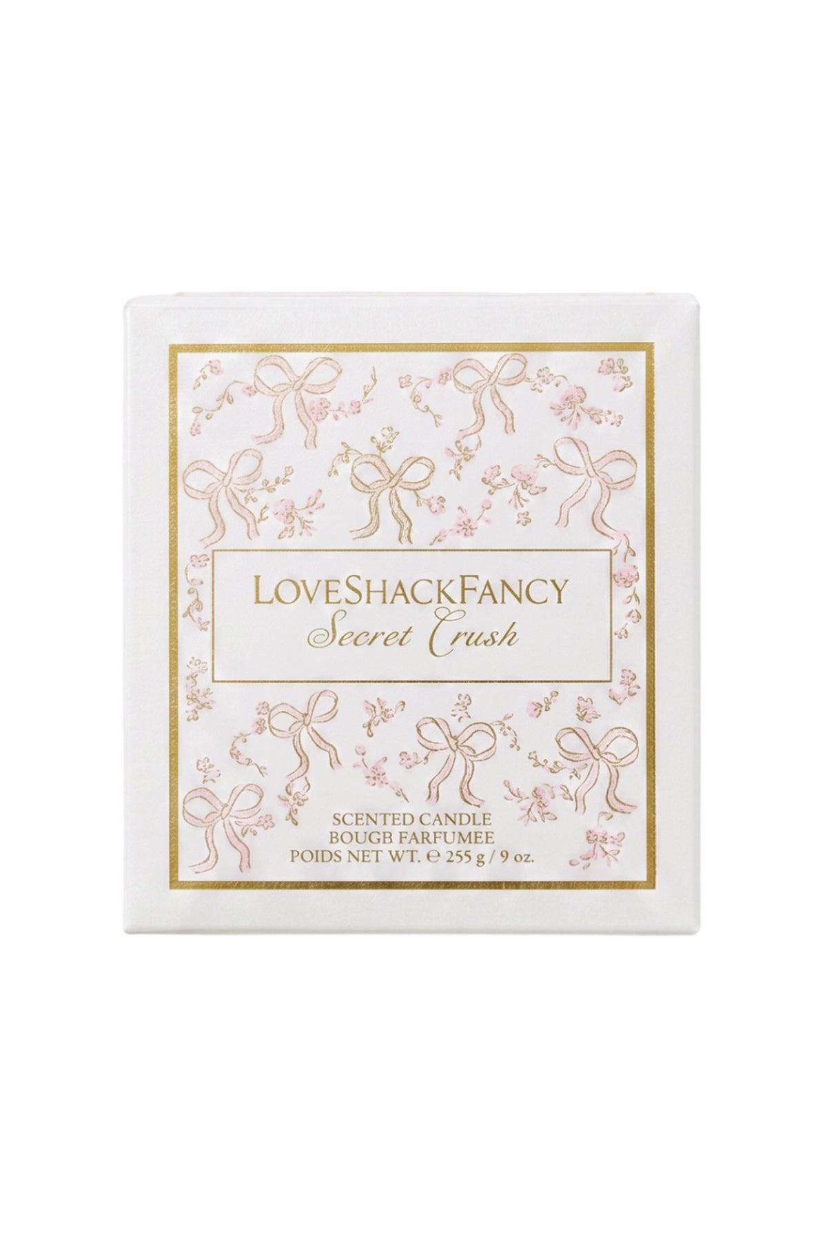 Scented candle box with “LoveShacksFancy Secret Crush” text and pink bow design