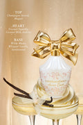 Cream vanity set with gold bow, perfume bottle, and candle in a decorative tray