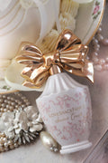 Cream vanity set featuring gold bow perfume bottle and pearl-style pearl accents