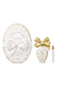 Oval cream perfume set with gold bow plus a matching mini bottle