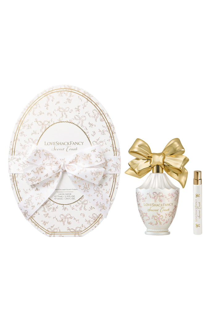 Oval cream perfume set with gold bow plus a matching mini bottle