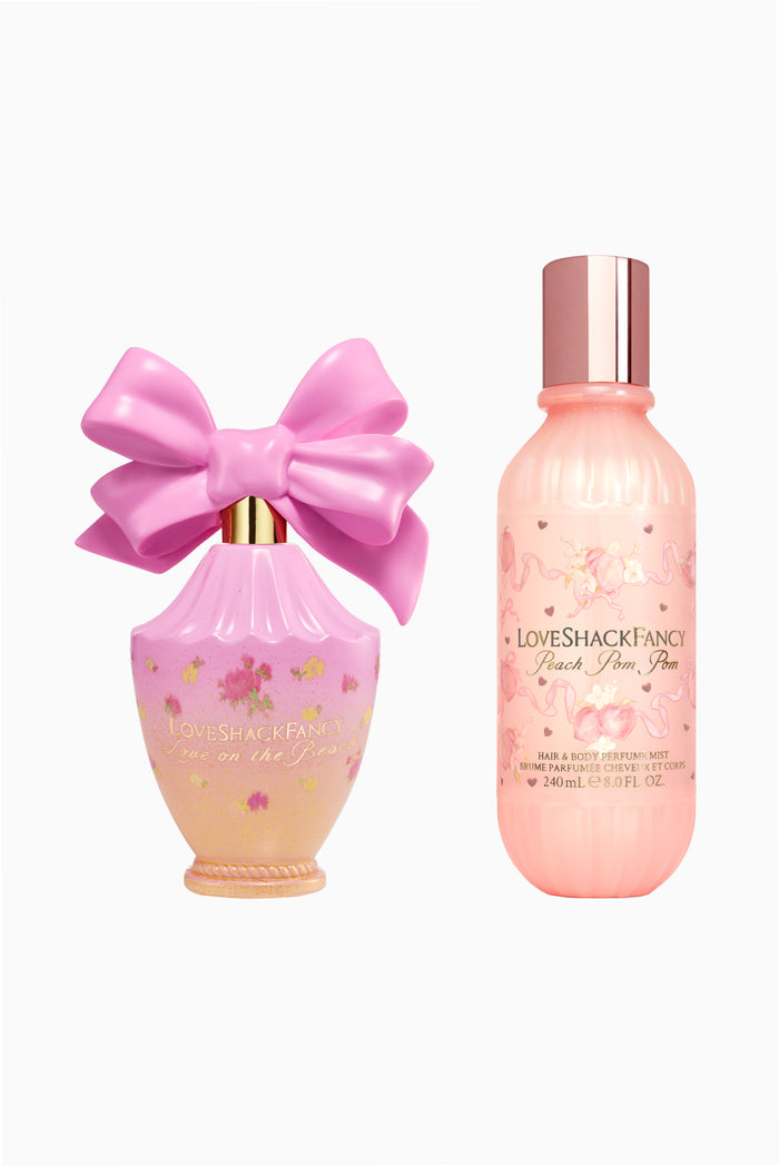 Two-piece pink fragrance set: LoveShackFancy bow bottle and body mist bottle