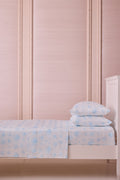 Light blue floral cotton sateen sheet set with allover blossom print and two pillows