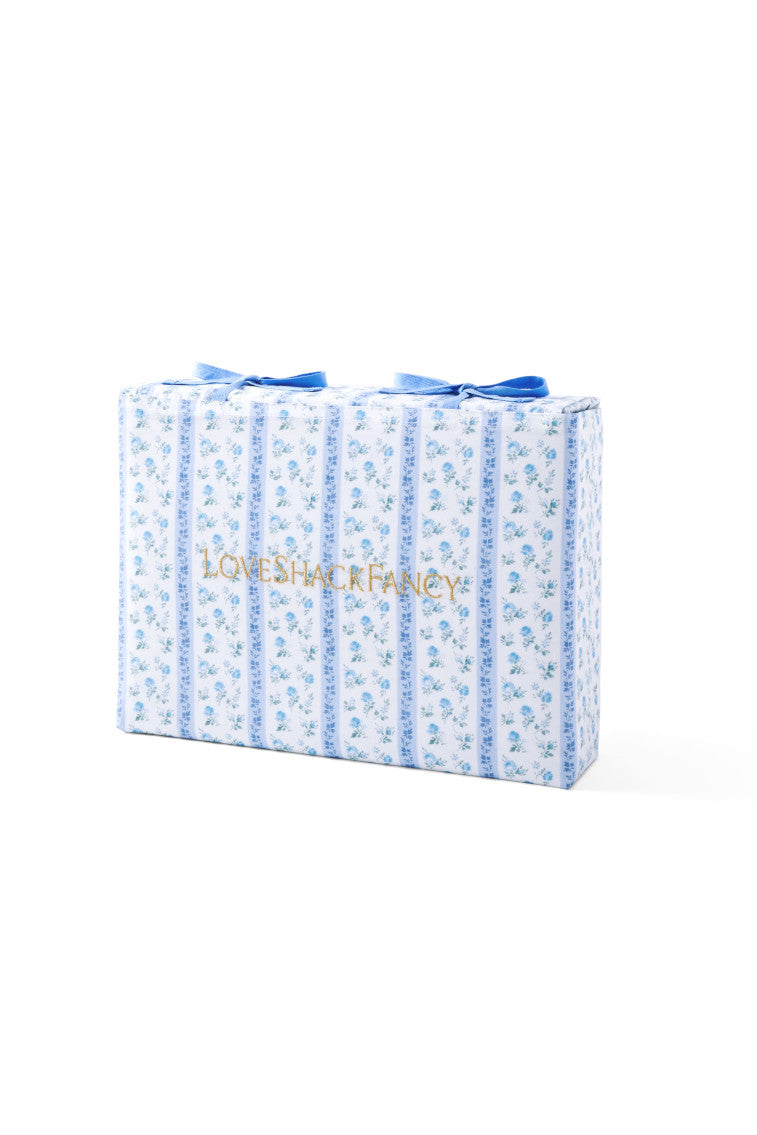 Blue printed cotton sheet set, folded, with small all-over pattern