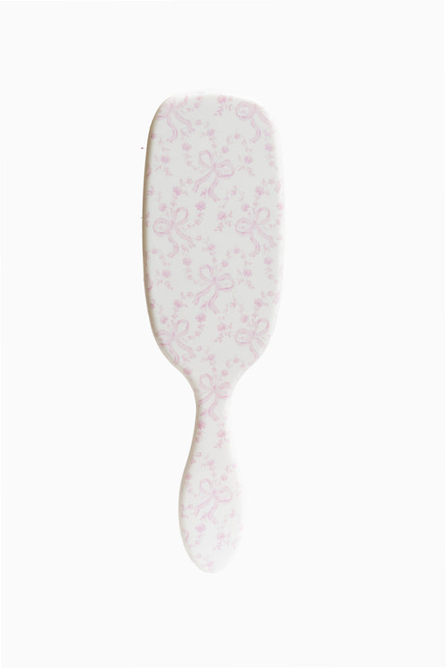 Wet Brush Smooth Styler hair brush with pink floral coquette bow pattern on pad