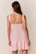 Light pink pointelle mini dress, back view with wide straps and flared skirt
