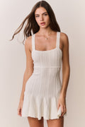 White pointelle mini dress with square neckline, fitted bodice, and flared skirt