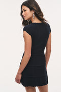 Dark navy pointelle stretch mini dress, back view with tiered skirt