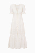 White cotton eyelet midi dress with puff sleeves and button-front, tiered hem