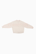 Cream mockneck crew sweatshirt with orange dotted print across the shoulders