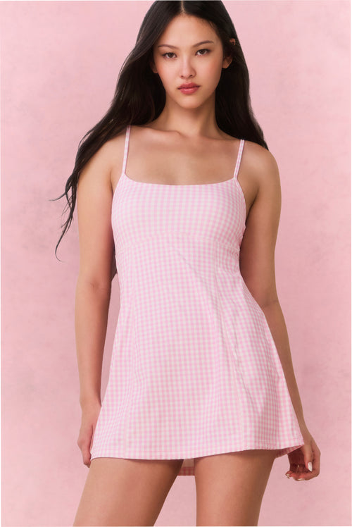 Pink gingham active dress with scoop neck, thin straps, and flared skirt