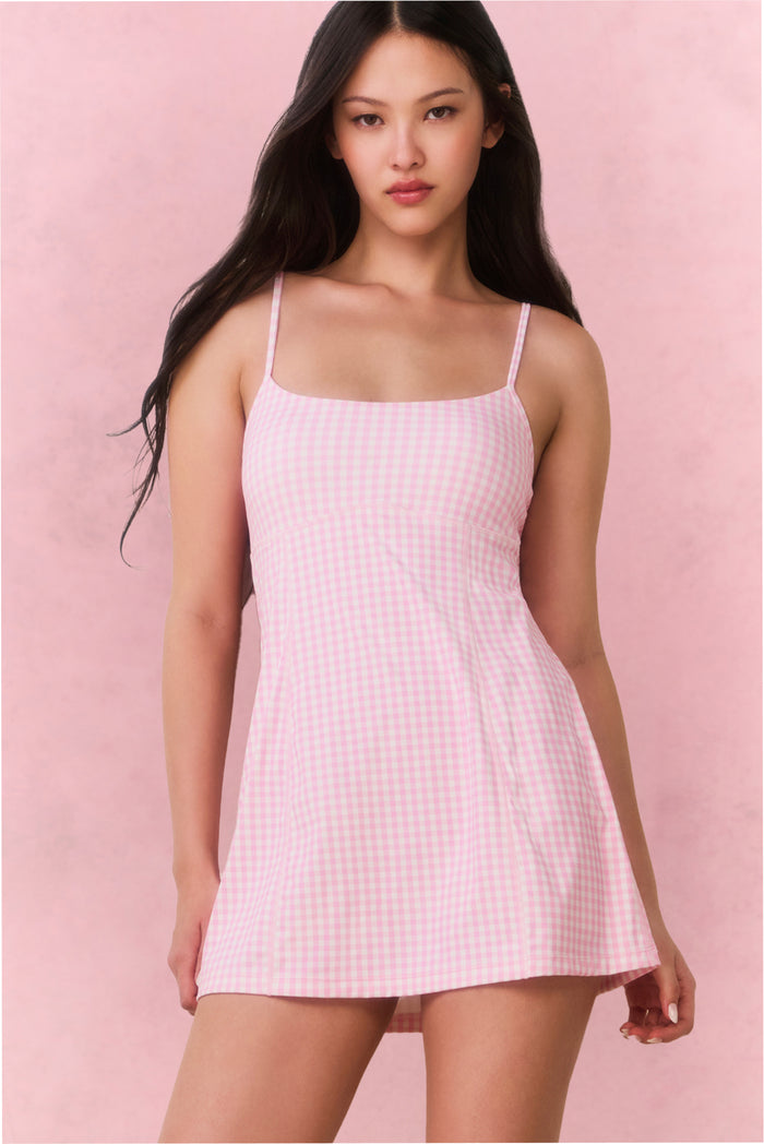 Pink gingham active dress with scoop neck, thin straps, and flared skirt