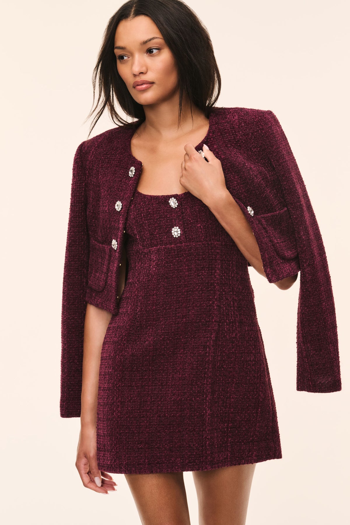 Bordeaux tweed open-front jacket with long sleeves and decorative buttons down the front