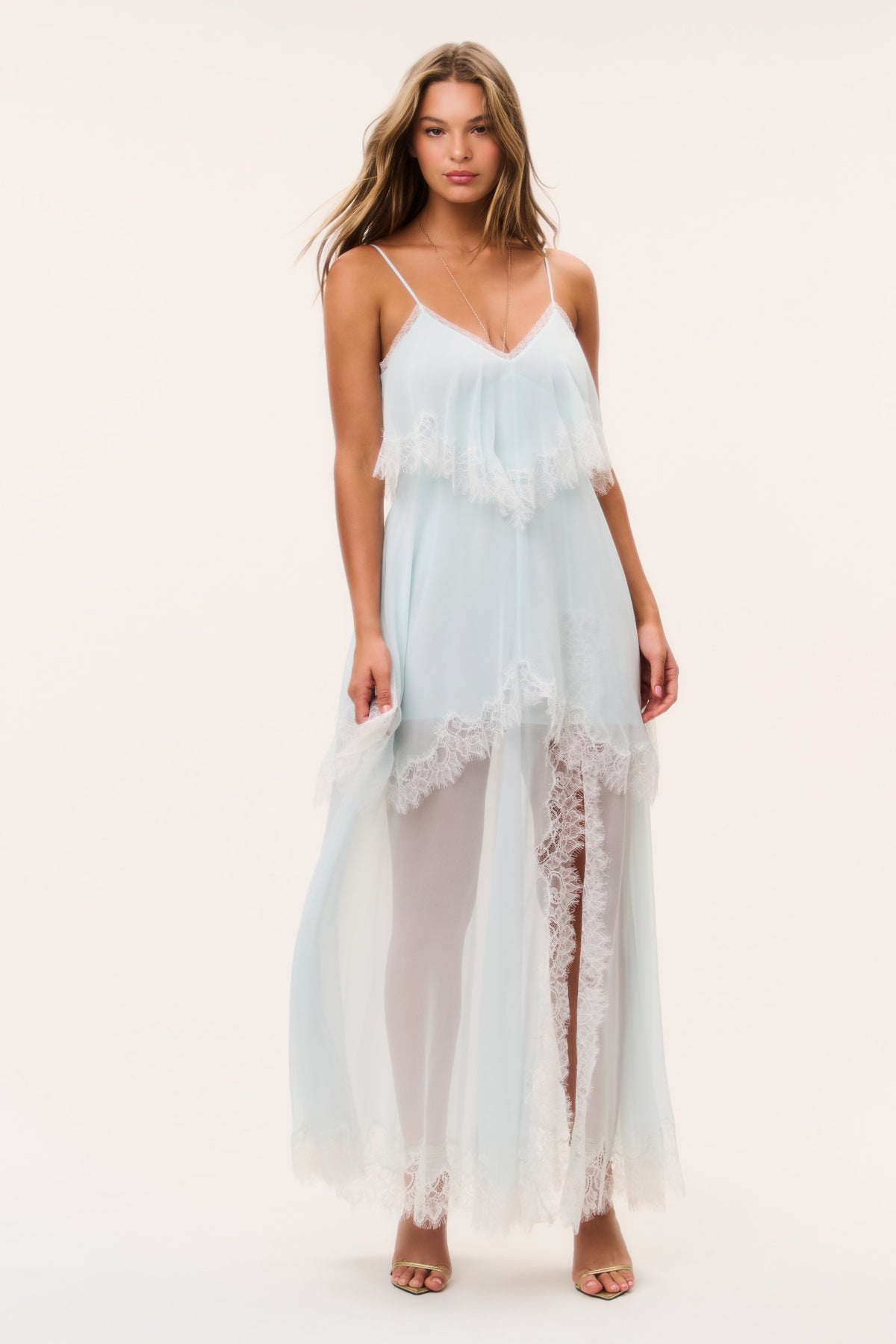Light aqua chiffon maxi dress with lace hem panels and fringe bodice; spaghetti straps.