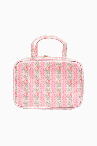 Pink floral print travel box with top handle and rounded front