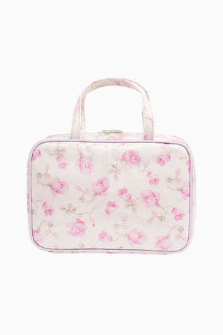 Pink floral print travel box with gold clasp and clear front panel