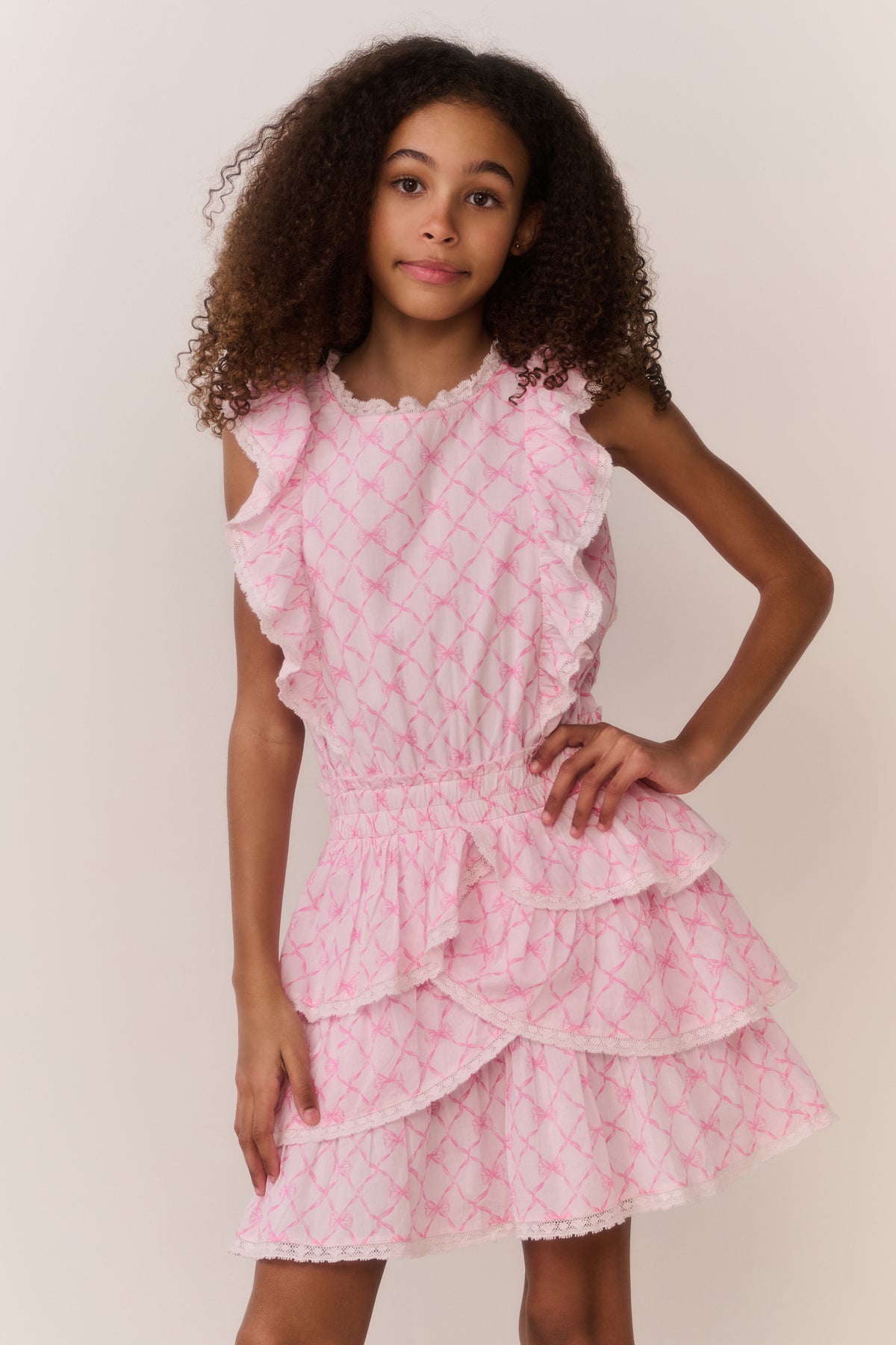 Pink lattice sweetheart tiered dress with layered ruffles at the hem