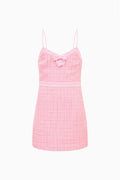 Pink tweed sleeveless dress with bow detail and thin spaghetti straps