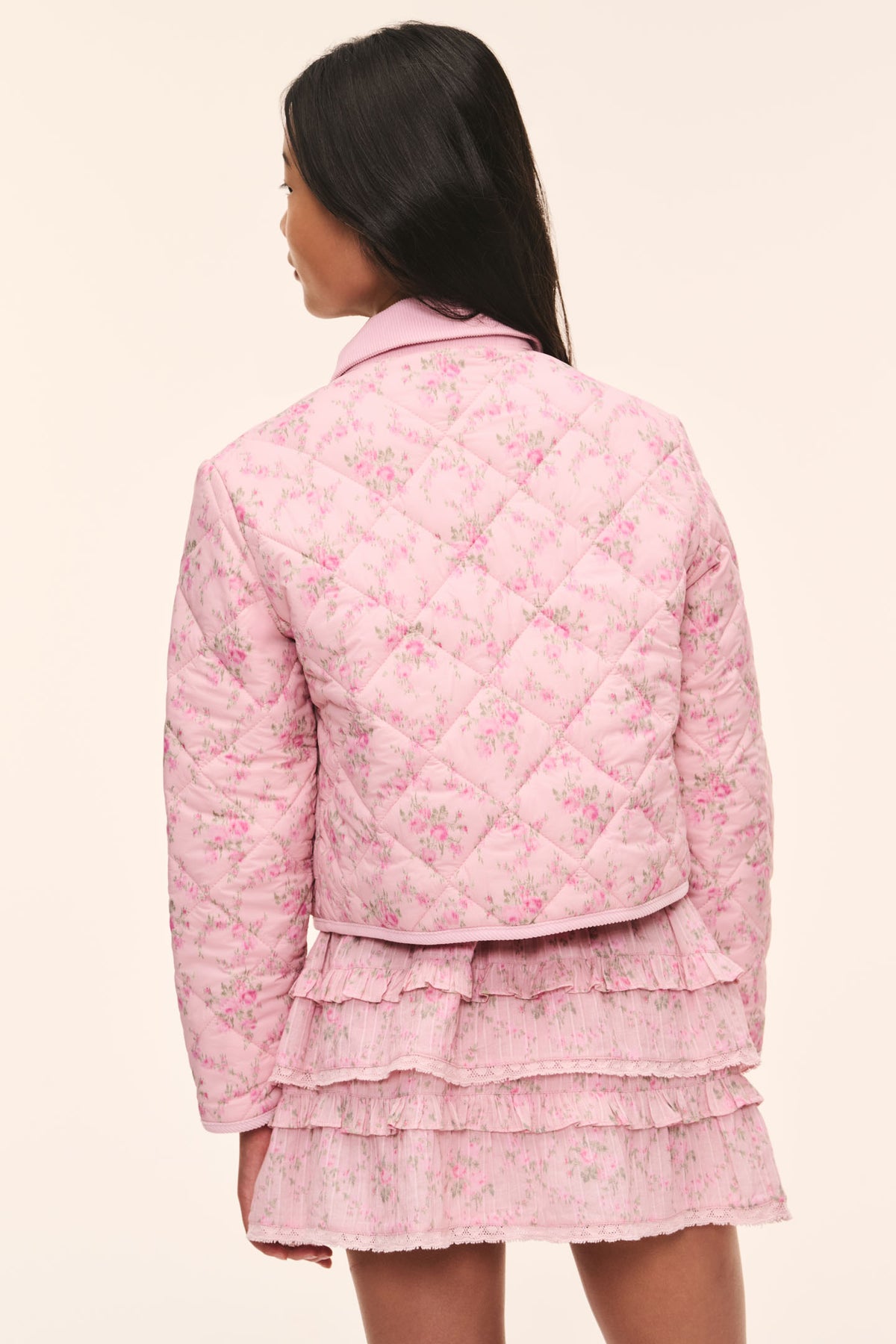 Kids pink floral quilted jacket, back view with gathered hem and stand collar