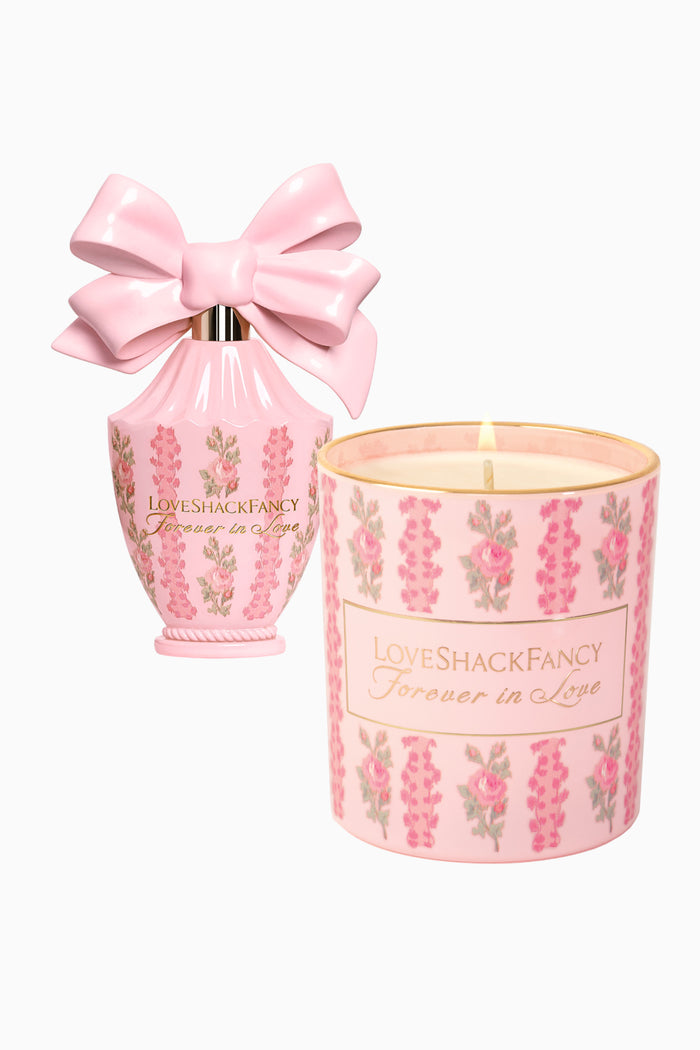 Pink floral candle jar with LoveShackFancy label, plus pink satin bow gift pouch
