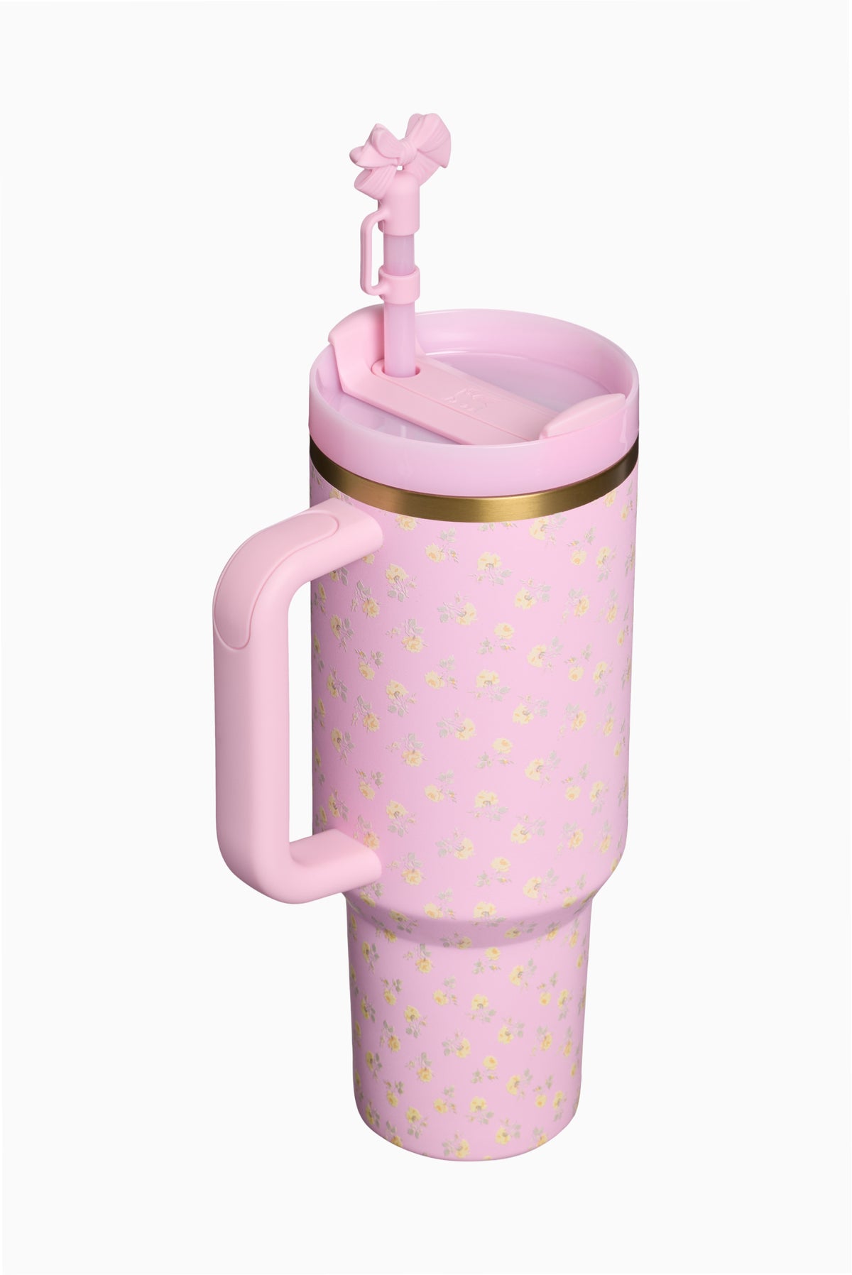 Pink Stanley tumbler with straw lid, flip spout, handle; gold rim and floral pattern