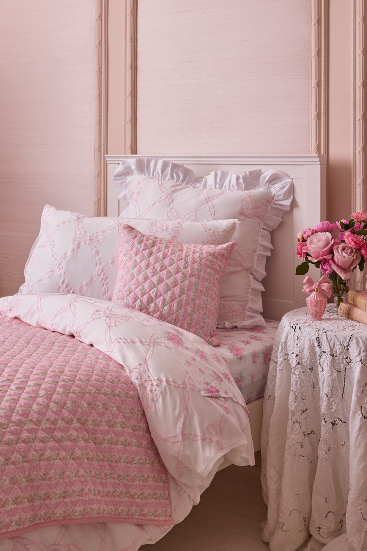 Rosewater euro pillow with embroidered lattice bows and layered ruffle trim