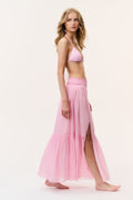 Umber cotton cover-up skirt in pink with small pattern, tiered maxi length, side view.