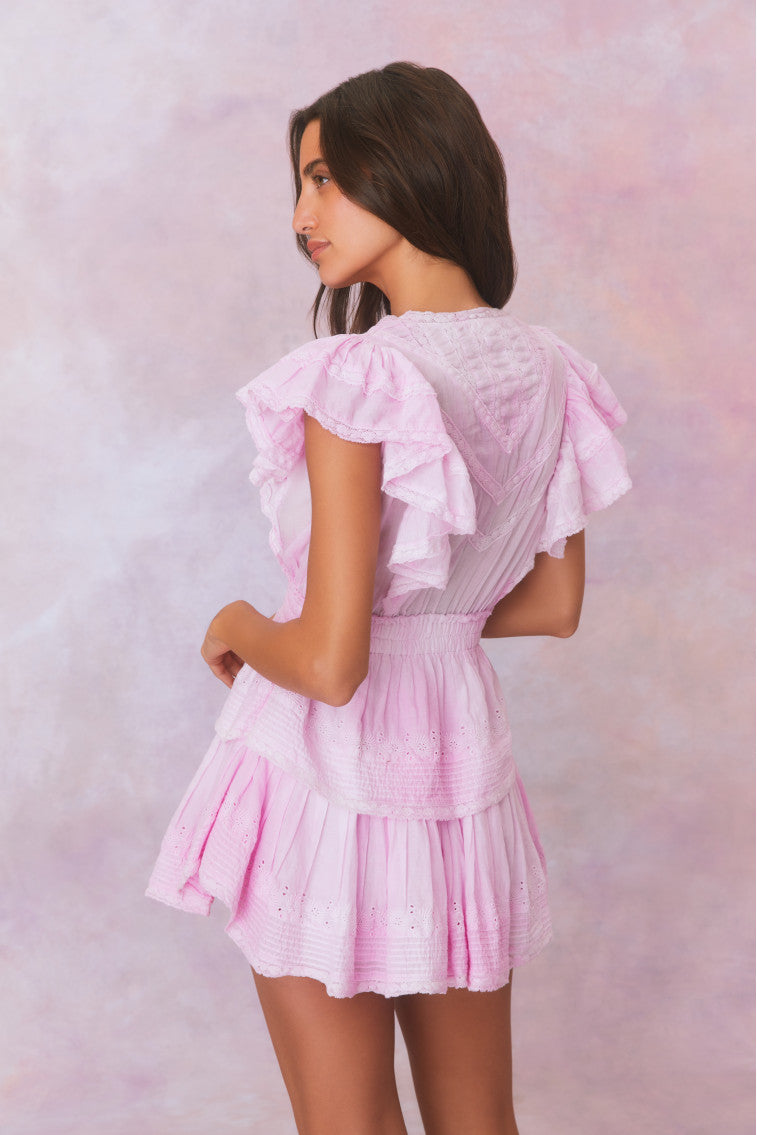 Peony pink mini dress back view with ruffled sleeves and tiered skirt