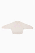 Cream mockneck crew sweatshirt with pink and blue dotted logo at center