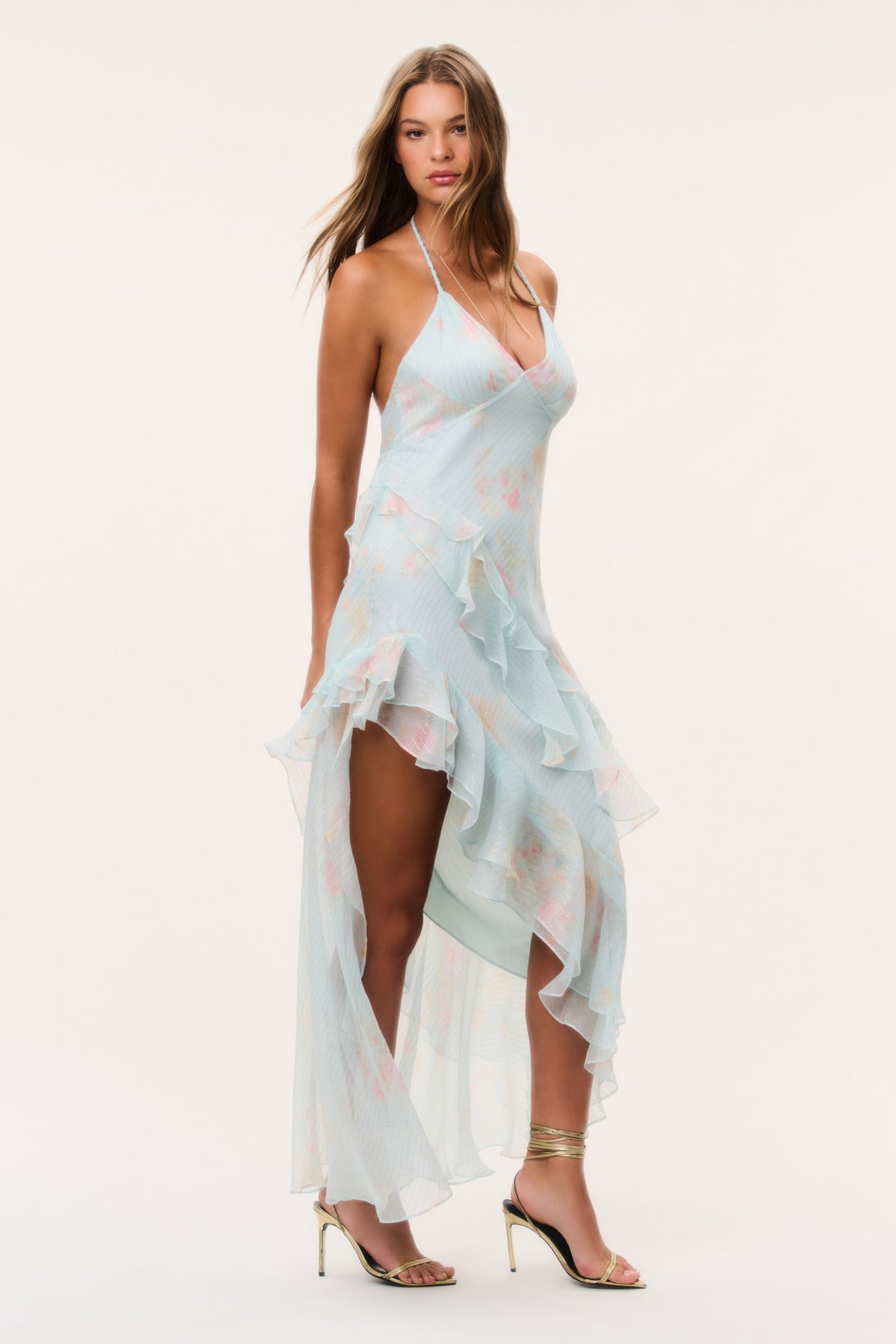 Side view light blue floral chiffon dress with asymmetrical layered ruffles and high slit