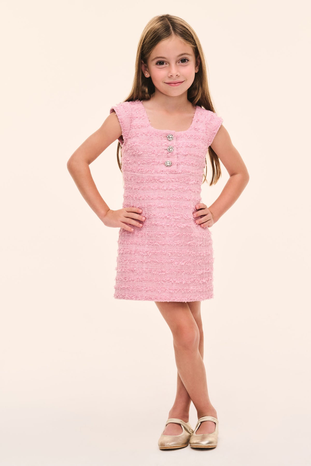 Girls pink tweed dress with cap sleeves, button front, and round neckline