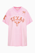 Pink varsity jersey dress with V-neck and Texas graphic front