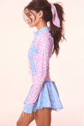 Floral active jacket back view, pink print with light-blue side panels
