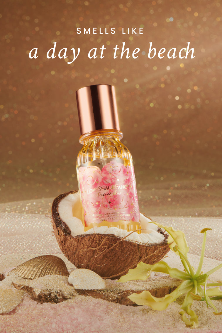 Single mini hair and body mist bottle with rose-gold cap, gold glass, pink floral label