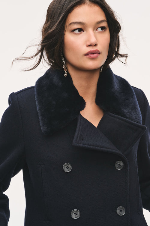 Navy peacoat with faux fur collar and buttoned double-breasted front detail