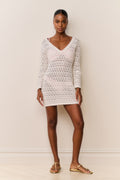 Cream crochet mini cover-up dress with long sleeves and V-neck, model standing full length