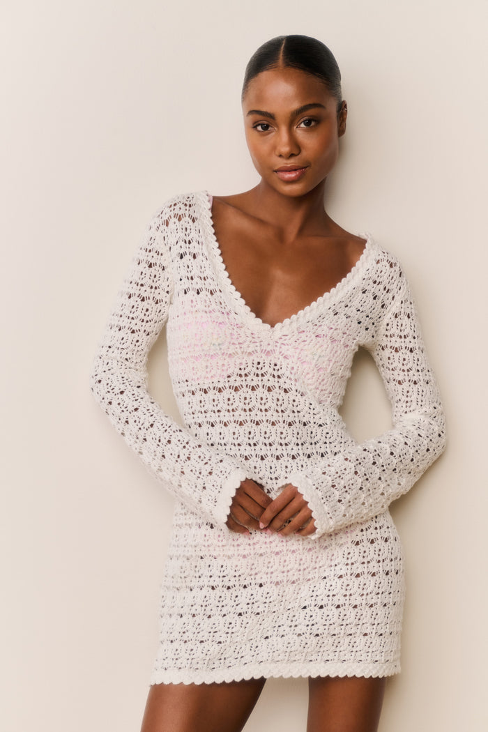 Cream crochet mini cover-up dress with V neckline and long sleeves, fitted mini