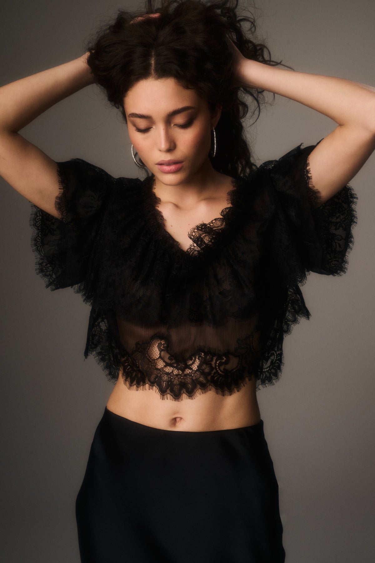 Black lace chiffon V-neck cropped top with sheer lace overlay, front close-up