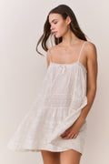 White lace mini dress with spaghetti straps and gathered neckline, relaxed fit