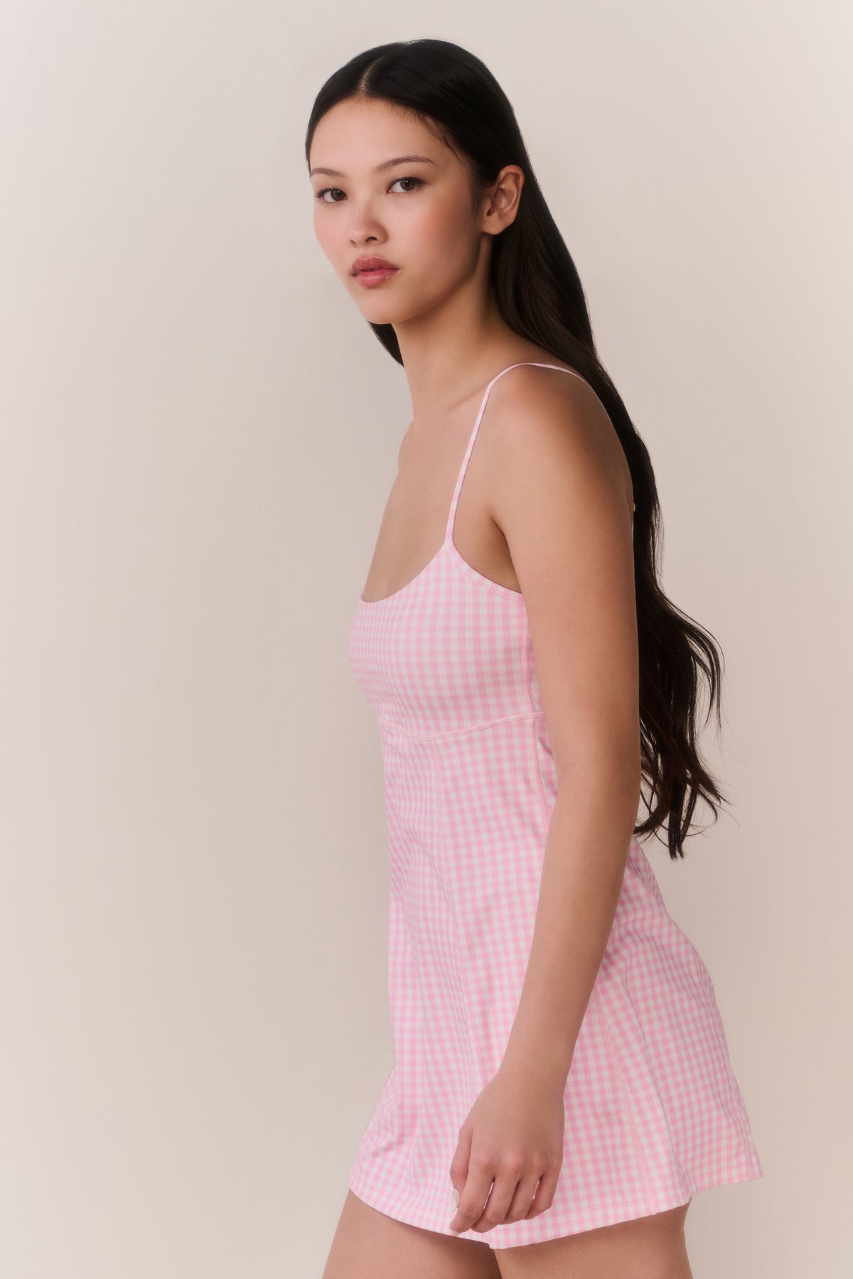 Pink gingham active dress with thin straps and flared skirt hem