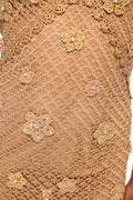 Close-up of metallic crochet mesh with floral embellishments and sequins