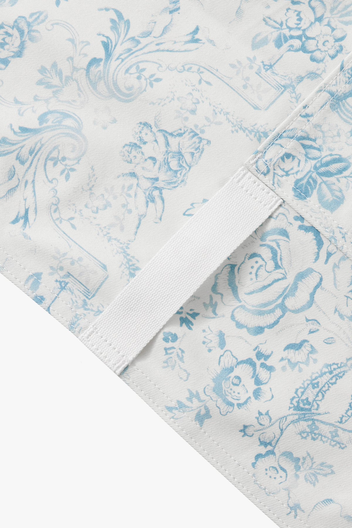 Light blue toile fabric with stitched hem and folded seam detail