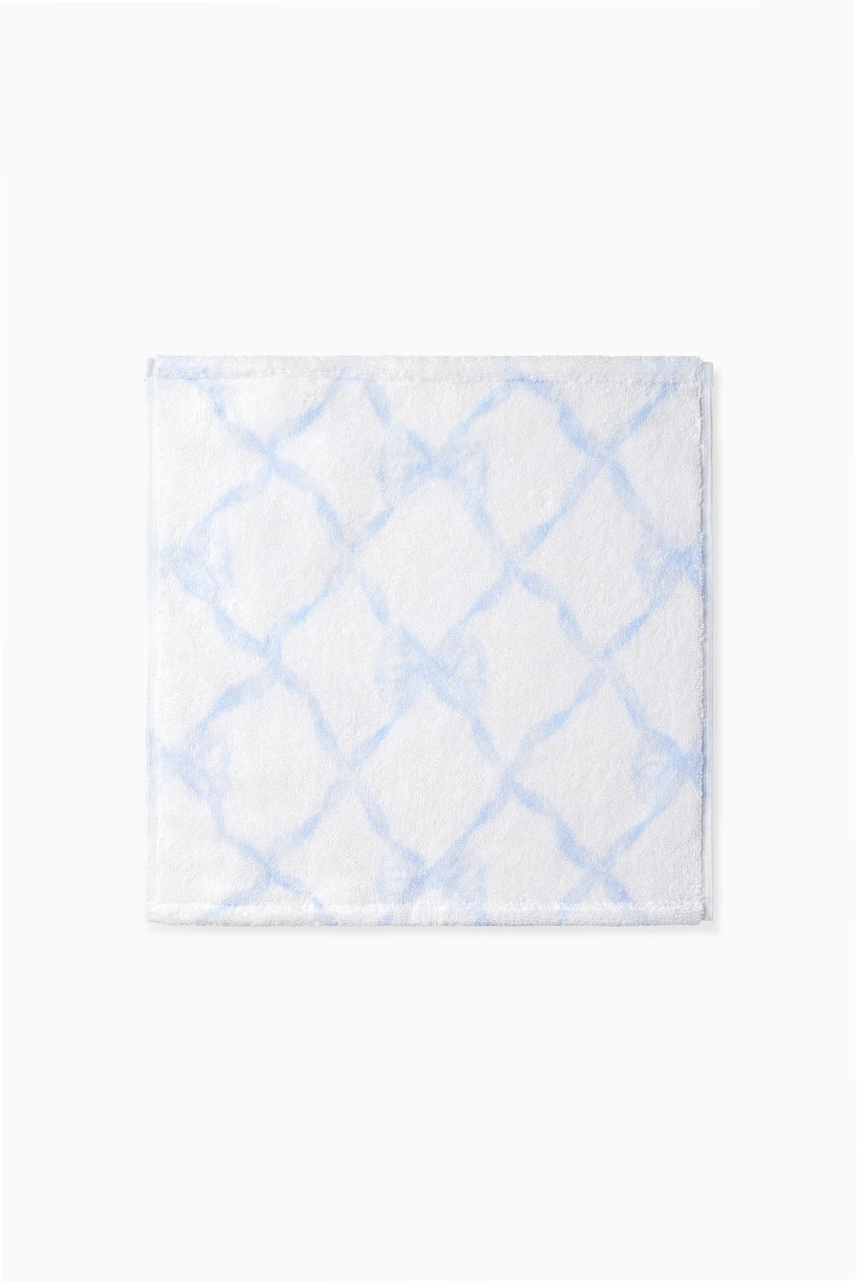 Blue printed wash cloth with a geometric lattice pattern