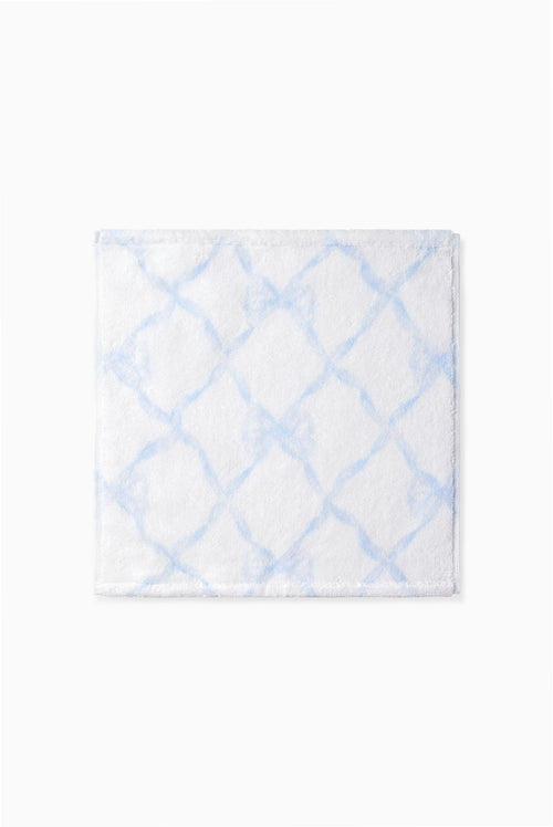 Blue printed wash cloth with a geometric lattice pattern