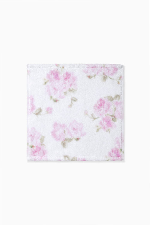 Pink printed wash cloth with a soft floral pattern