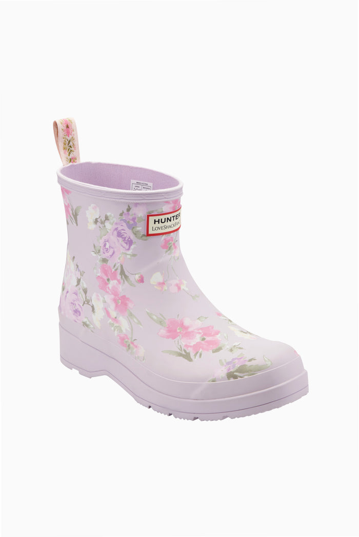 Women’s short rain boots in light purple with floral bouquet print, front angled view