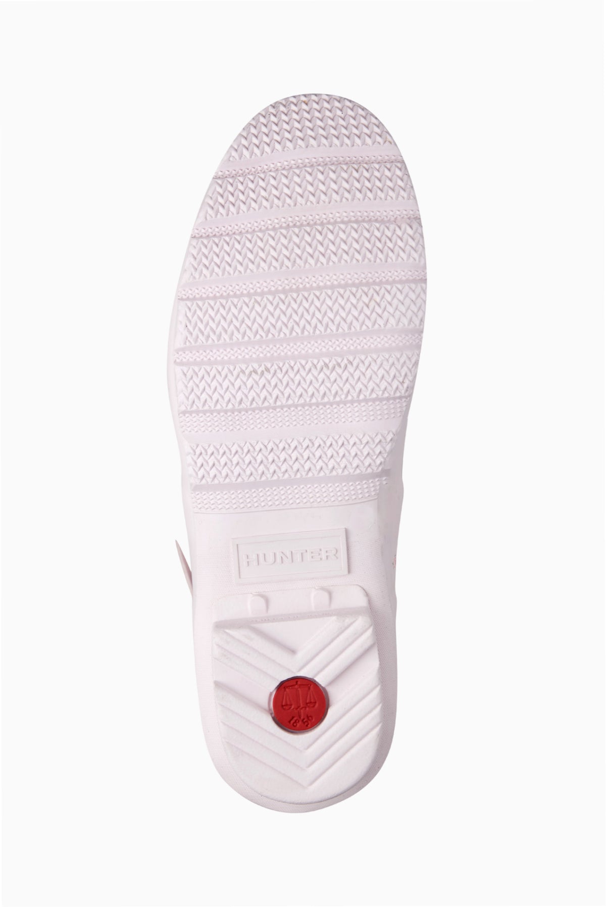 Light pink tall rain boot sole with textured tread and Hunter logo at heel