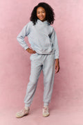 Tween light blue floral sweatpants, front view with drawstring waist and ankle cuffs