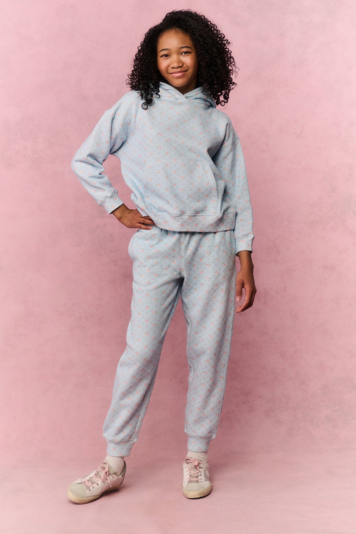 Tween light blue floral sweatpants, front view with drawstring waist and ankle cuffs